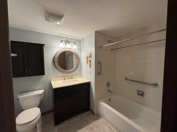 a bathroom with a sink a toilet and a bathtub