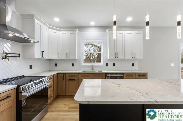 a view of a livingroom with a ceiling fan and window