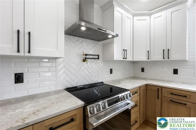 an empty room with closet and a chandelier fan