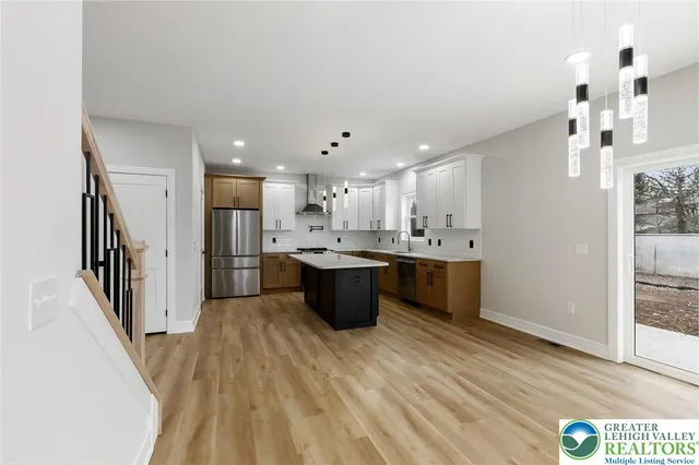 a bathroom with 2 sink and a mirror