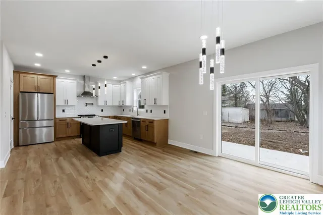 a bathroom with double sink and a mirror
