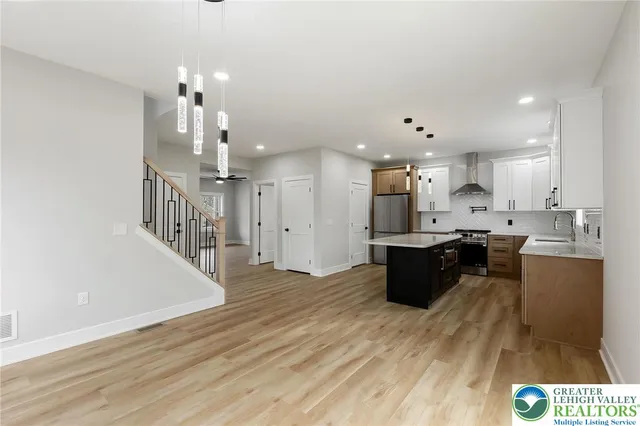 a bathroom with a double vanity sink a mirror and shower