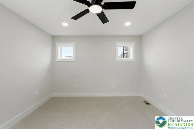 a large kitchen with stainless steel appliances granite countertop a stove and a sink