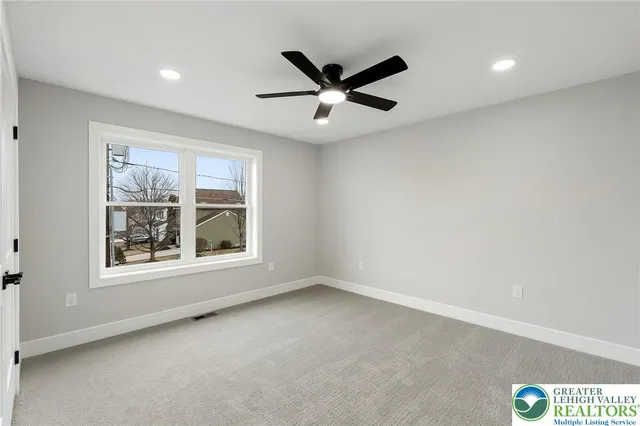a kitchen with a sink cabinets and wooden floor