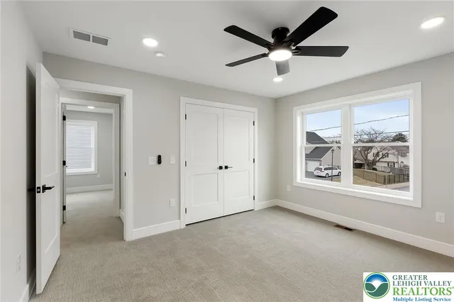 a kitchen with granite countertop a sink a stove and cabinets