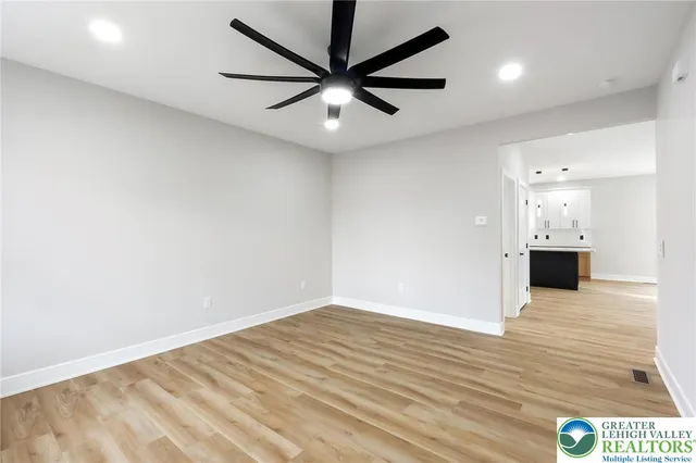 a bathroom with a sink a toilet and window