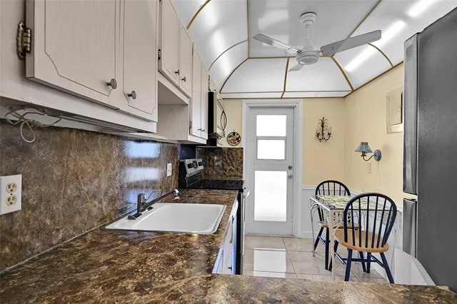 a bathroom with a sink a mirror and a bathtub
