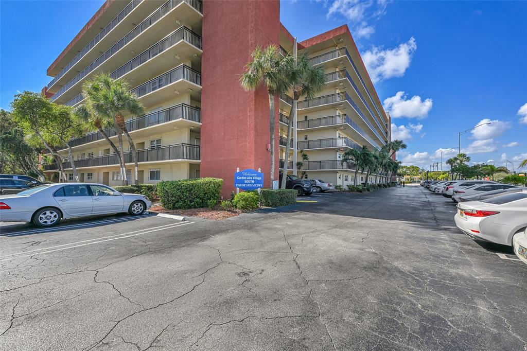 2350 Northeast 14th Street Causeway, Unit 609 Pompano Beach, FL 33062 - Photo 29 of 42 a view of a car parked in front of a building