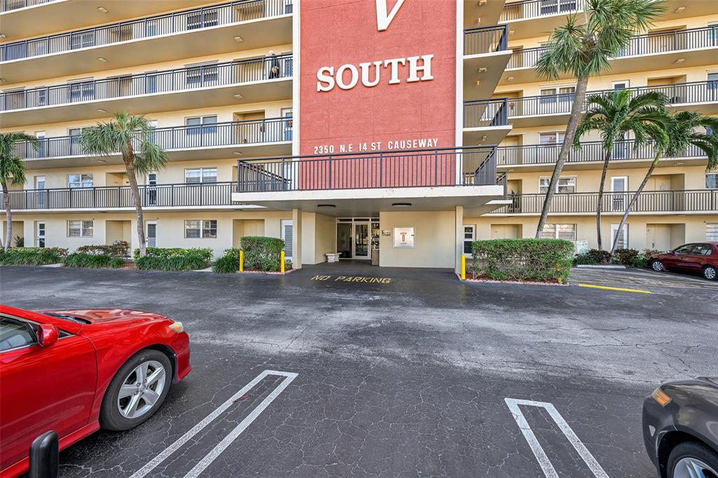 2350 Northeast 14th Street Causeway, Unit 609 Pompano Beach, FL 33062 - Photo 31 of 42 a car parked in front of a house