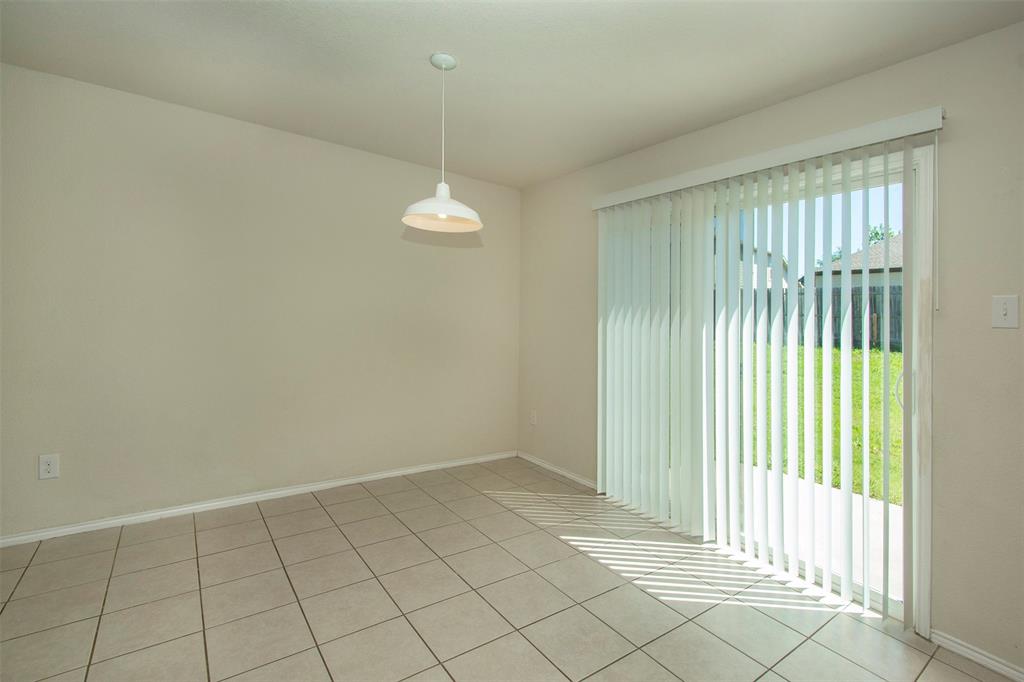 1423 Swan Ridge Drive Sherman, TX 75092 - Photo 6 of 21 Empty room with light tile patterned floors and baseboards