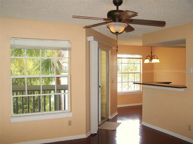 a kitchen with stainless steel appliances granite countertop a refrigerator and a stove