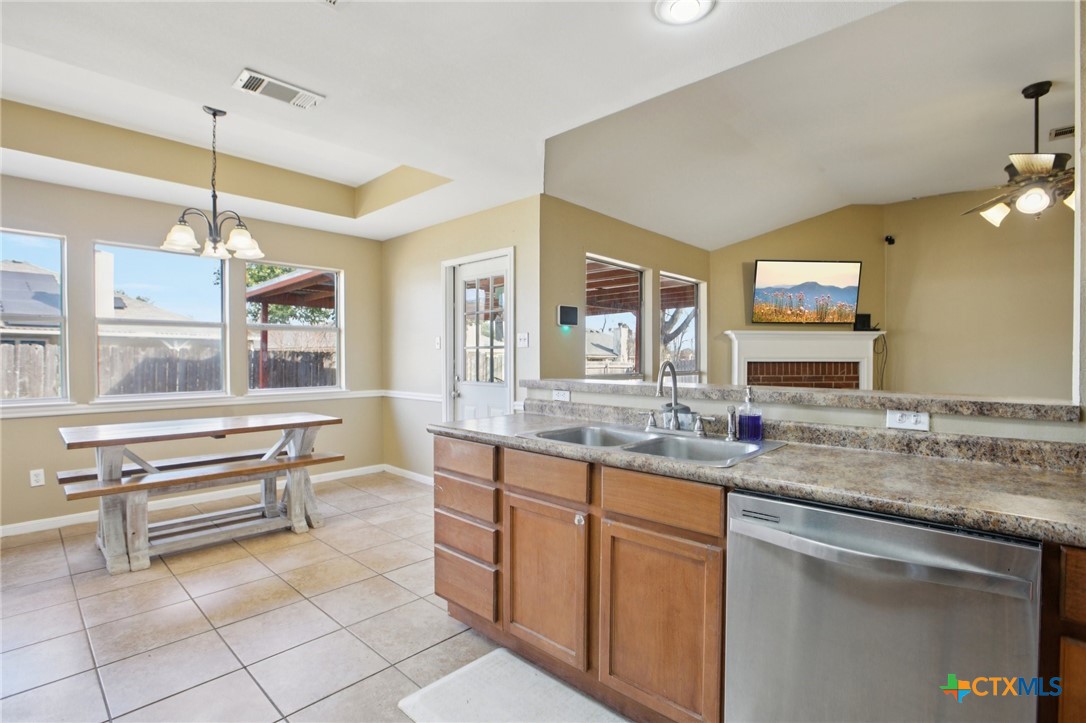 7114 Pappus Court Temple, TX 76502 - Photo 15 of 28 a bathroom with a granite countertop sink and a large mirror