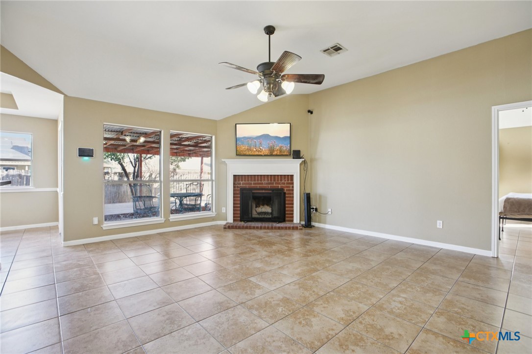 7114 Pappus Court Temple, TX 76502 - Photo 3 of 28 a view of a livingroom with a fireplace and window