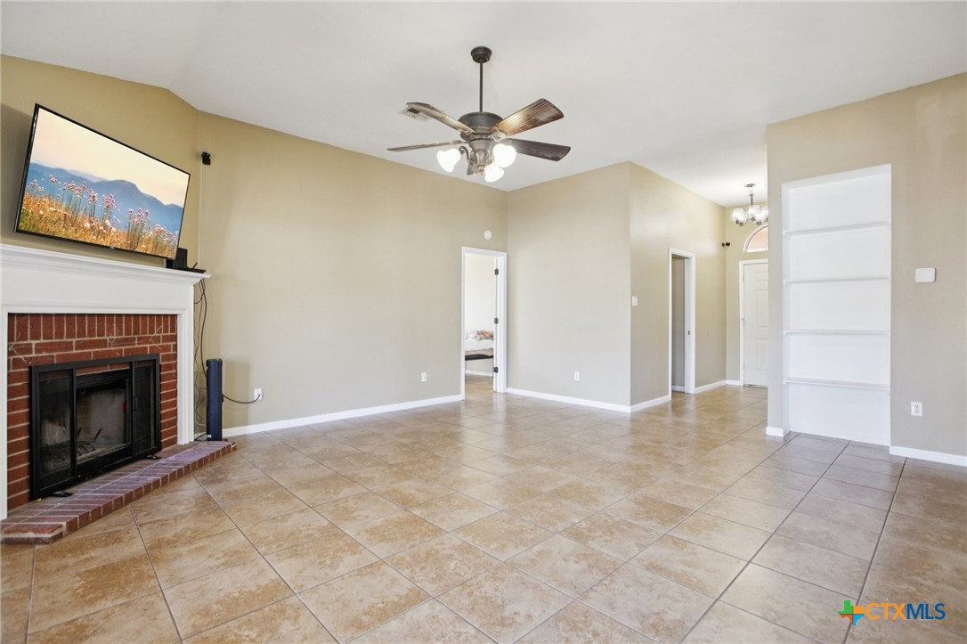 7114 Pappus Court Temple, TX 76502 - Photo 8 of 28 a view of an empty room with a fireplace