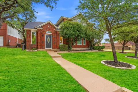 a backyard of a house with lots of green space