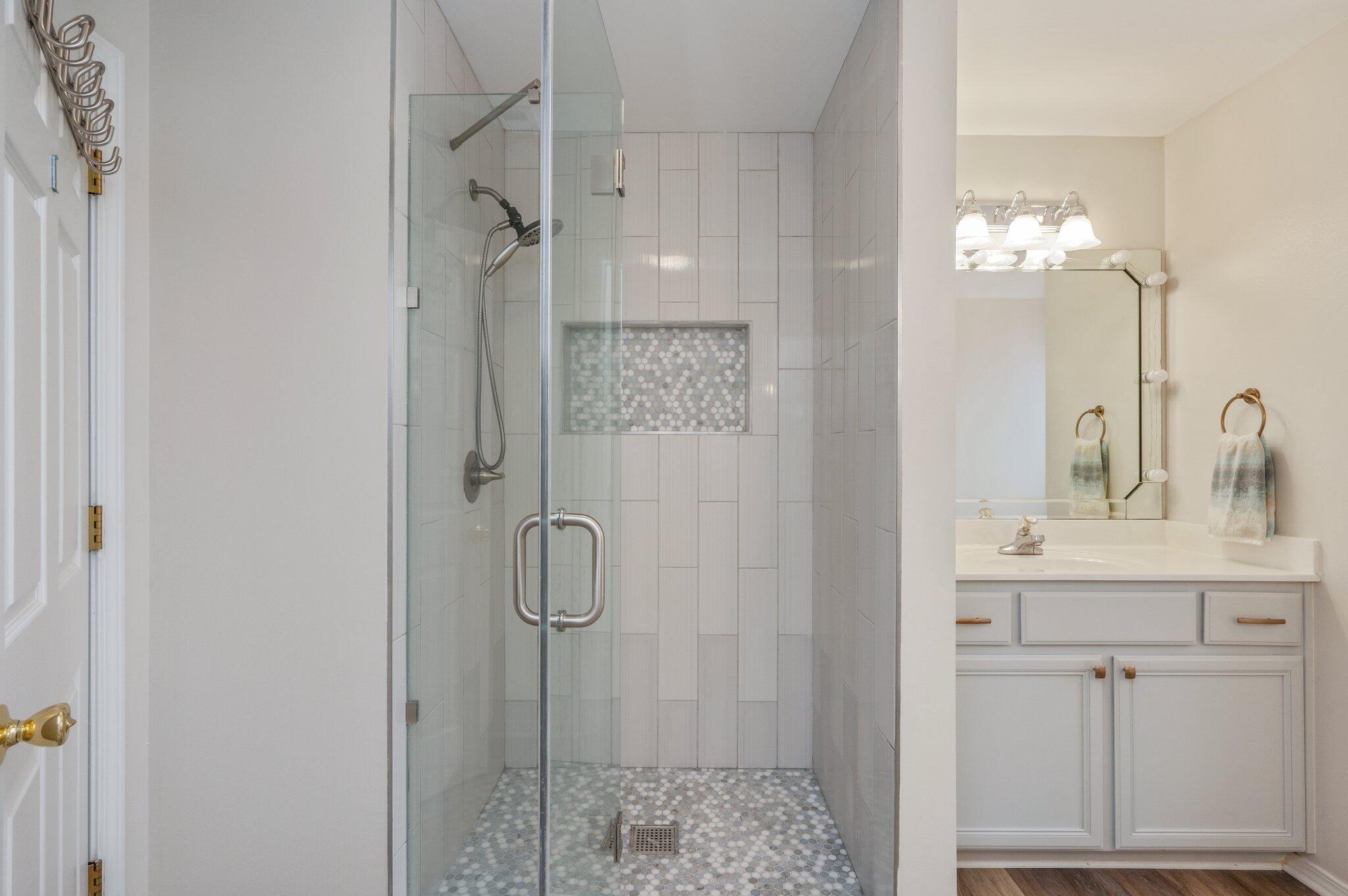 730 Denise Drive Crestview, FL 32536 - Photo 18 of 40 a bathroom with a shower a sink and a mirror