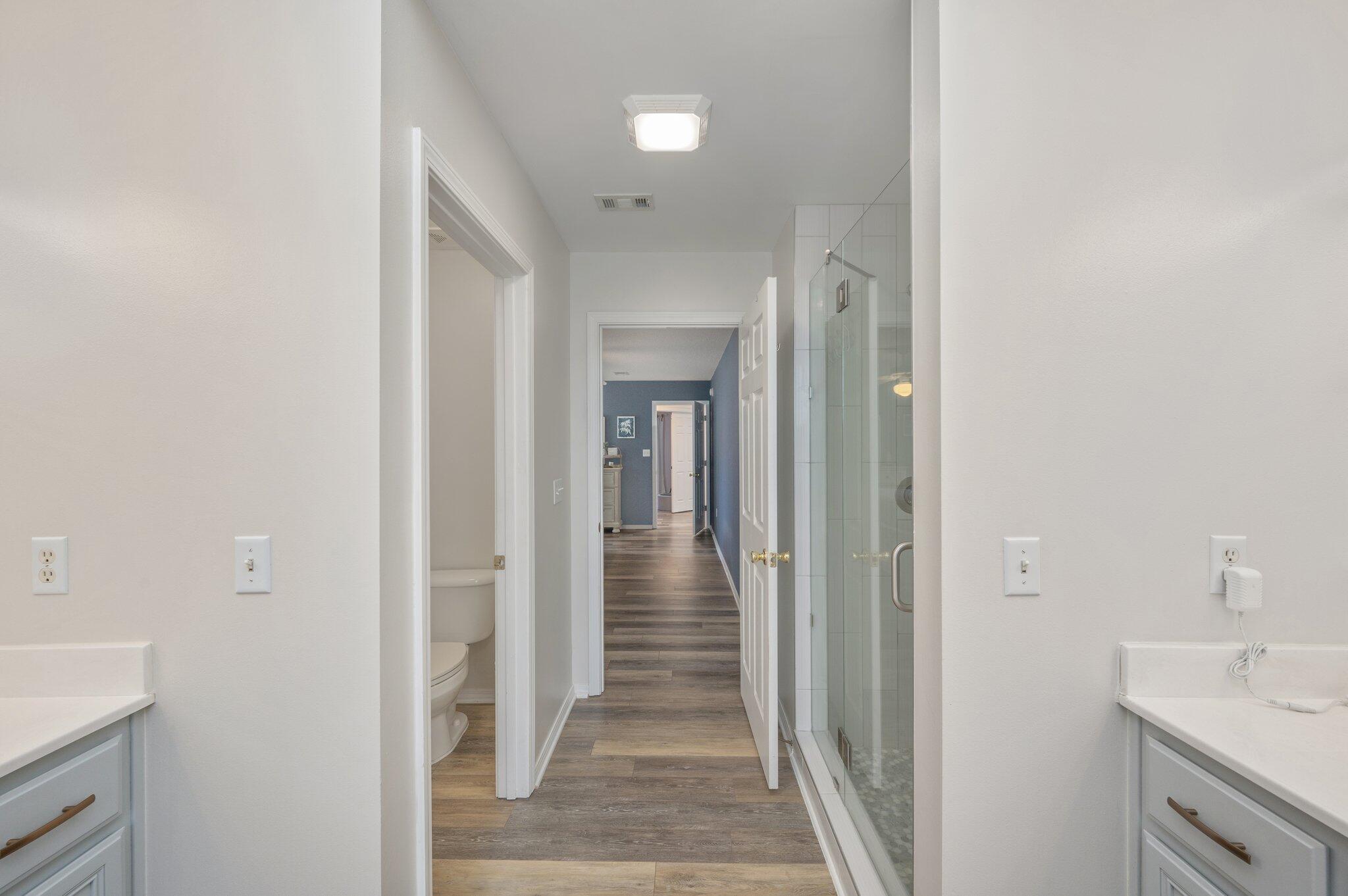 730 Denise Drive Crestview, FL 32536 - Photo 22 of 40 a view of a hallway view with wooden floor and staircase