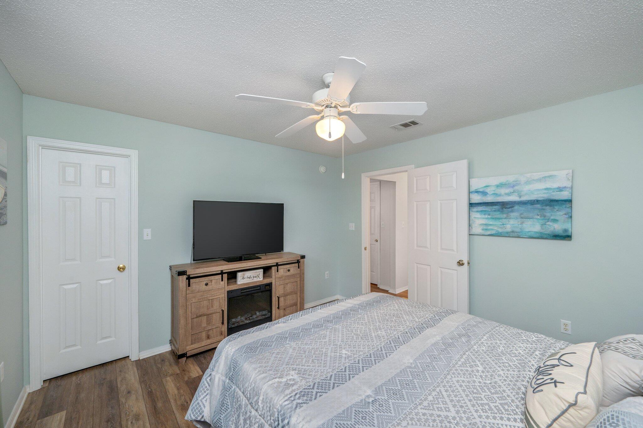 730 Denise Drive Crestview, FL 32536 - Photo 26 of 40 a bedroom with a bed and a flat screen tv