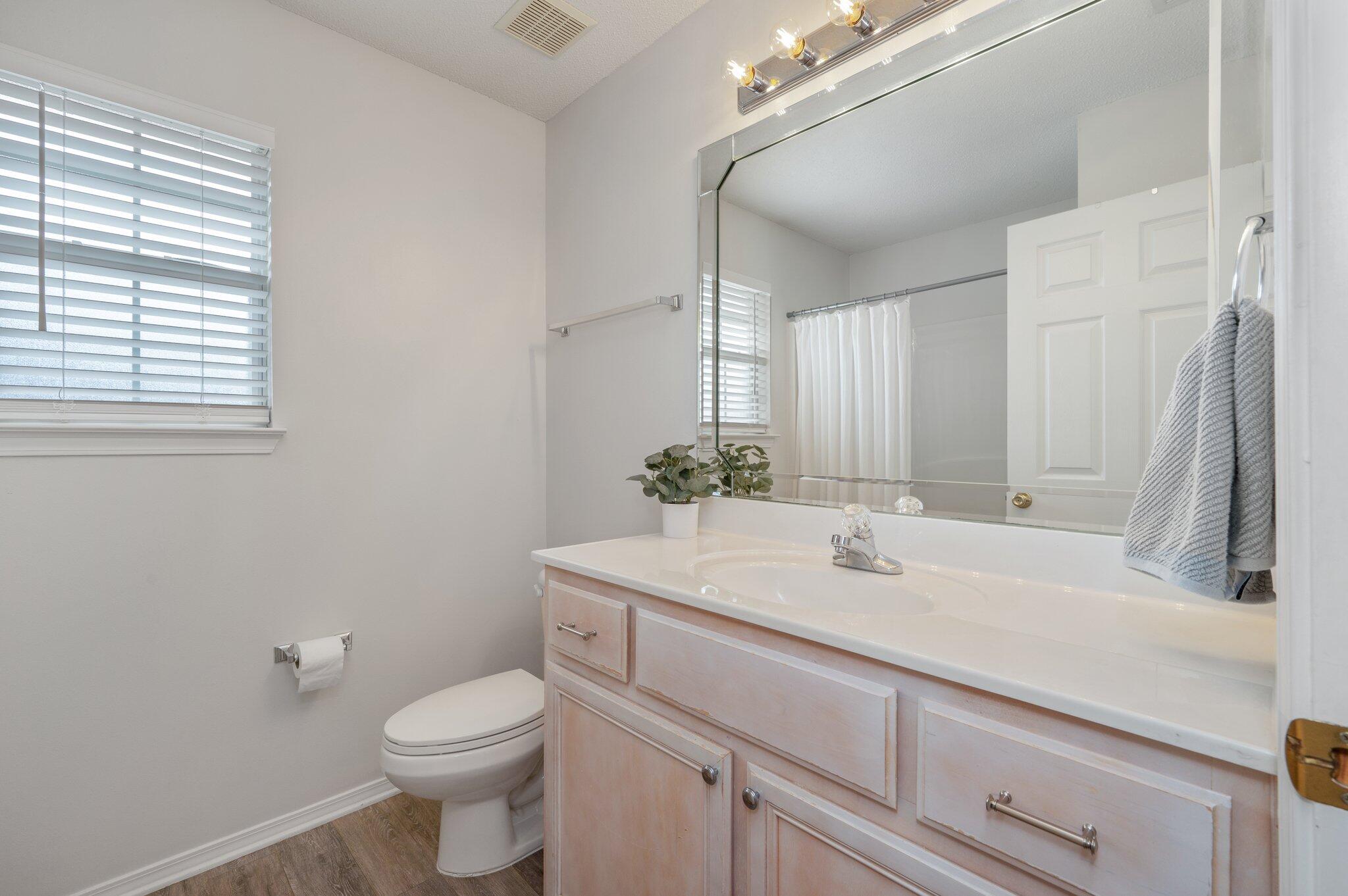 730 Denise Drive Crestview, FL 32536 - Photo 27 of 40 a bathroom with a sink a toilet and mirror