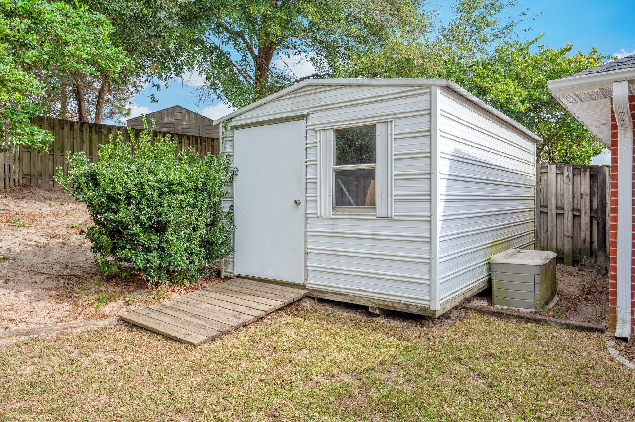 730 Denise Drive Crestview, FL 32536 - Photo 35 of 40 a view of a backyard with plants and large tree