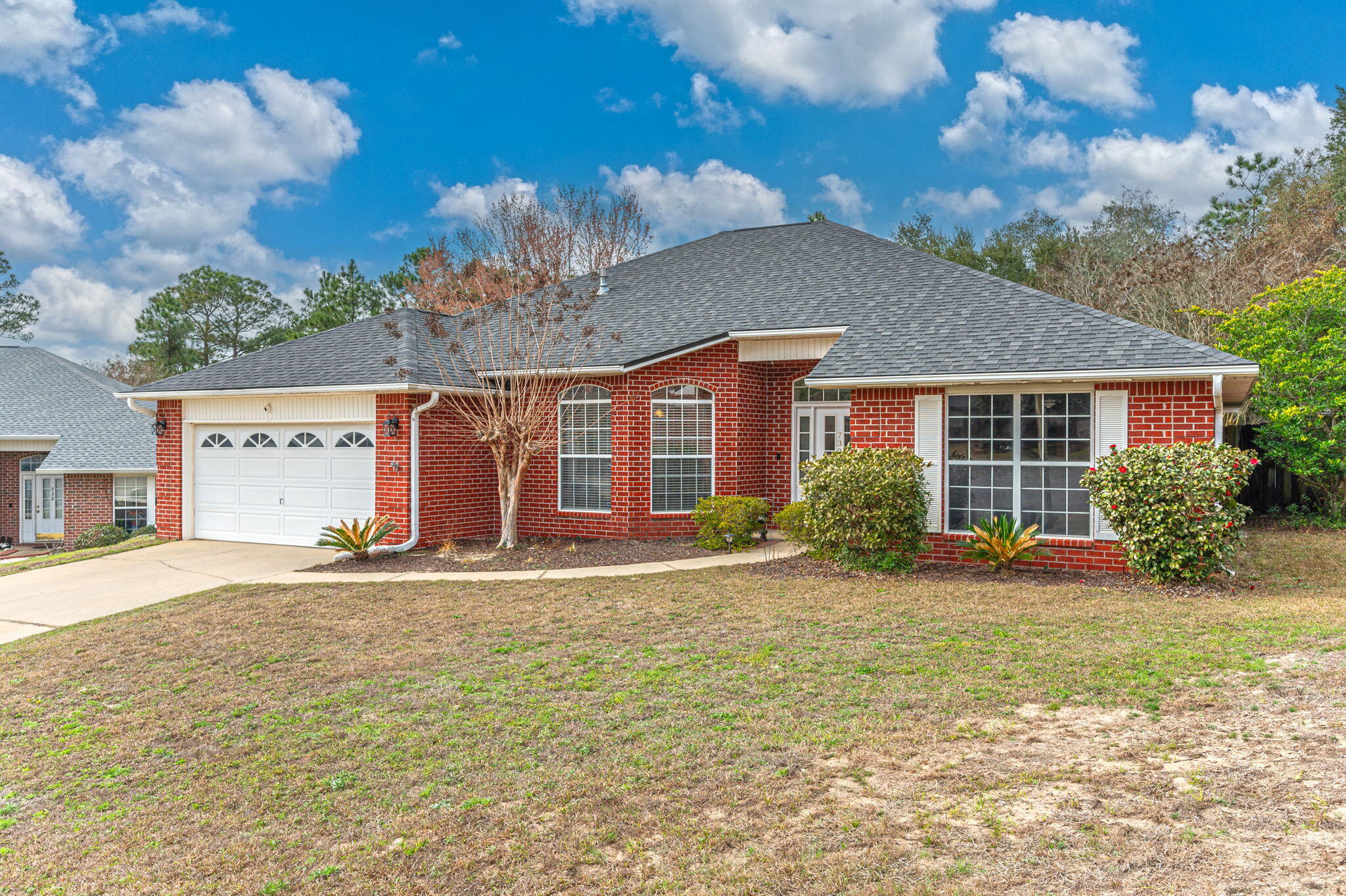 730 Denise Drive Crestview, FL 32536 - Photo 39 of 40 a front view of a house with a yard and garage