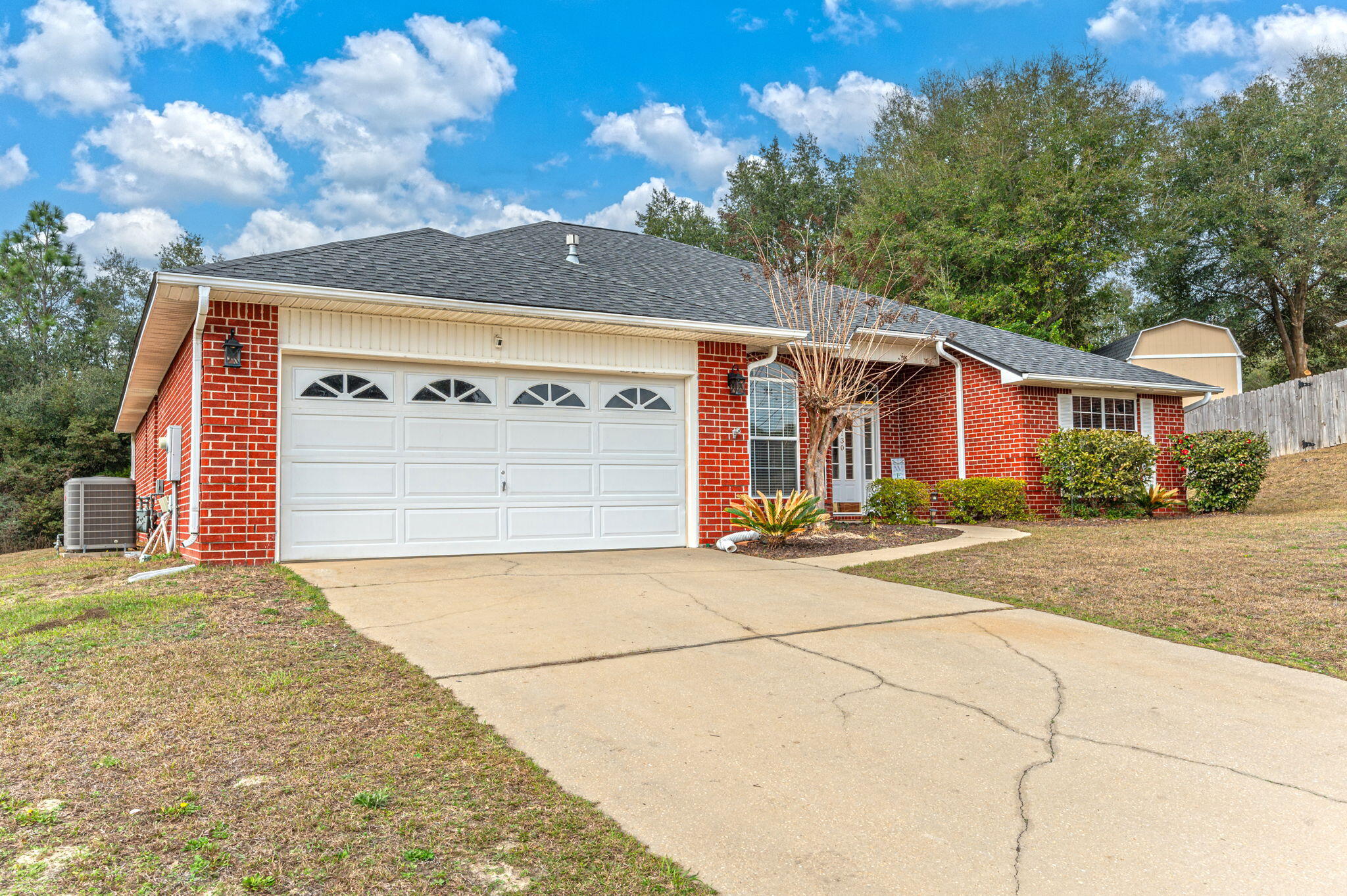 730 Denise Drive Crestview, FL 32536 - Photo 40 of 40 a front view of a house with a yard and garage
