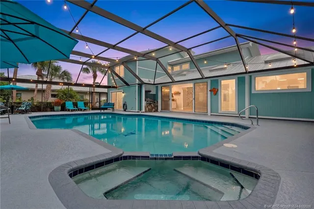 a view of a swimming pool with a yard