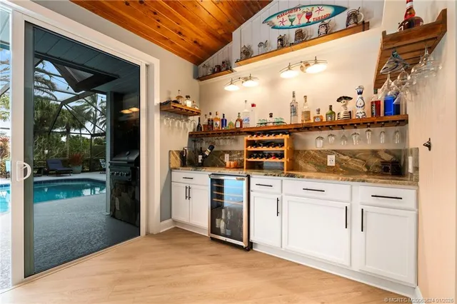 a kitchen with a refrigerator and a stove