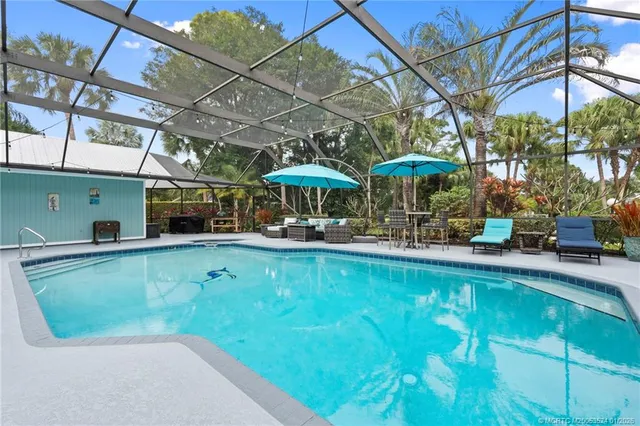 a view of a swimming pool with a patio