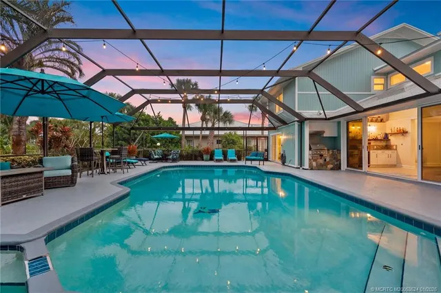 a view of a swimming pool with a patio
