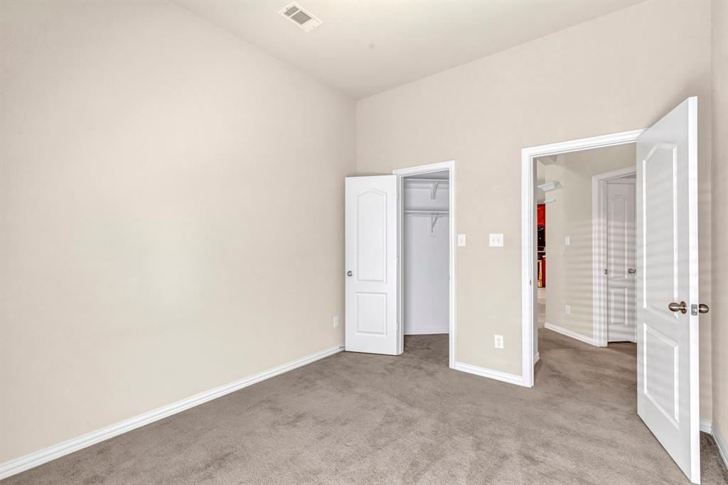 5316 Ridgeson Drive McKinney, TX 75071 - Photo 30 of 33 Spacious room with neutral wall paint and grey carpeting