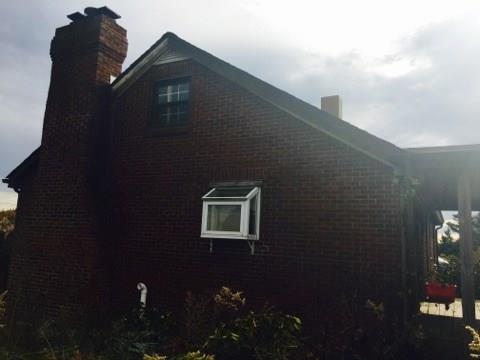 524 Friel Road Baden, PA 15005 - Photo 24 of 25 Side view of home. White window is located in kitchen.