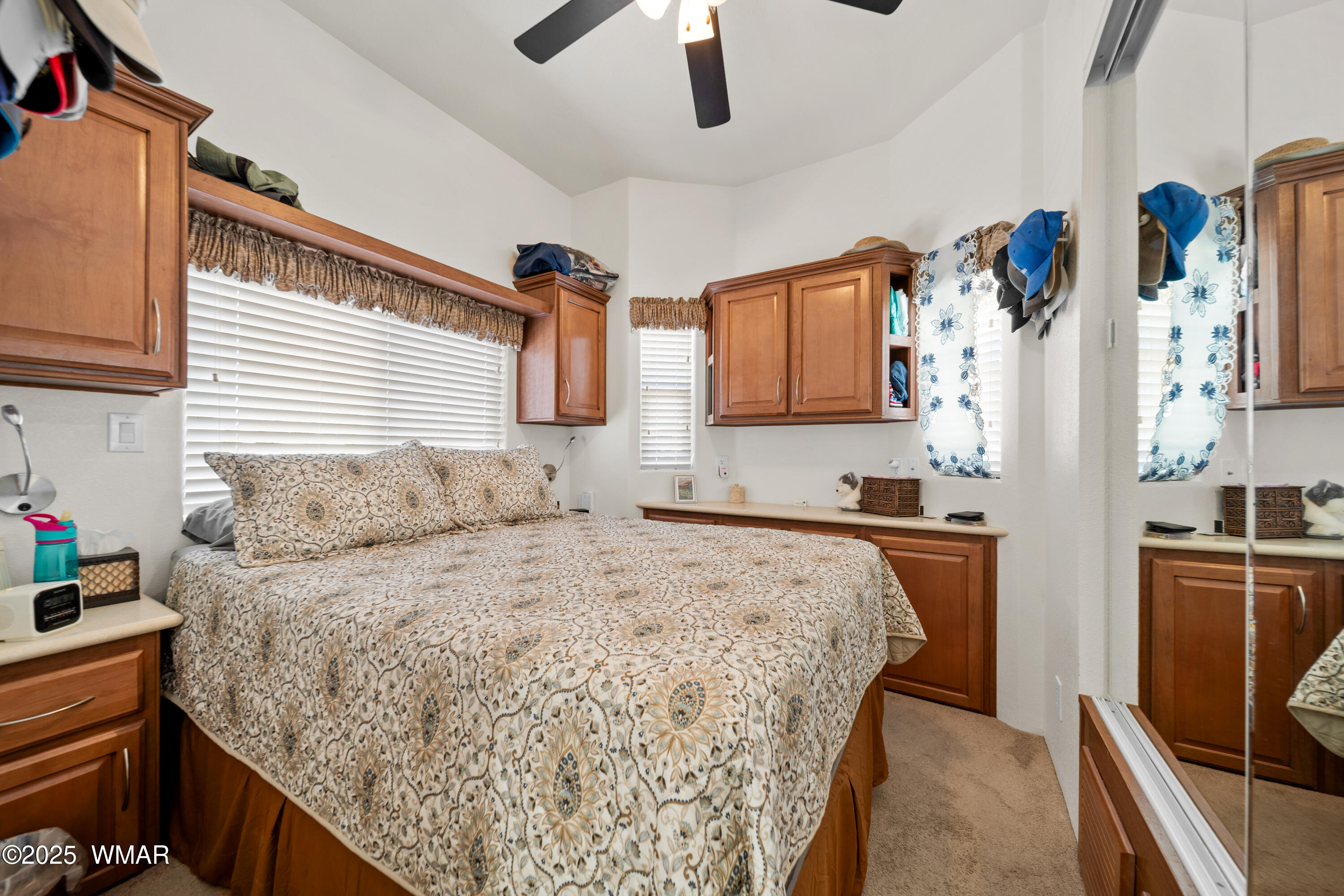 8213 Apache Way, Unit 415 Show Low, AZ 85901 - Photo 12 of 16 a bedroom with a bed dresser and window