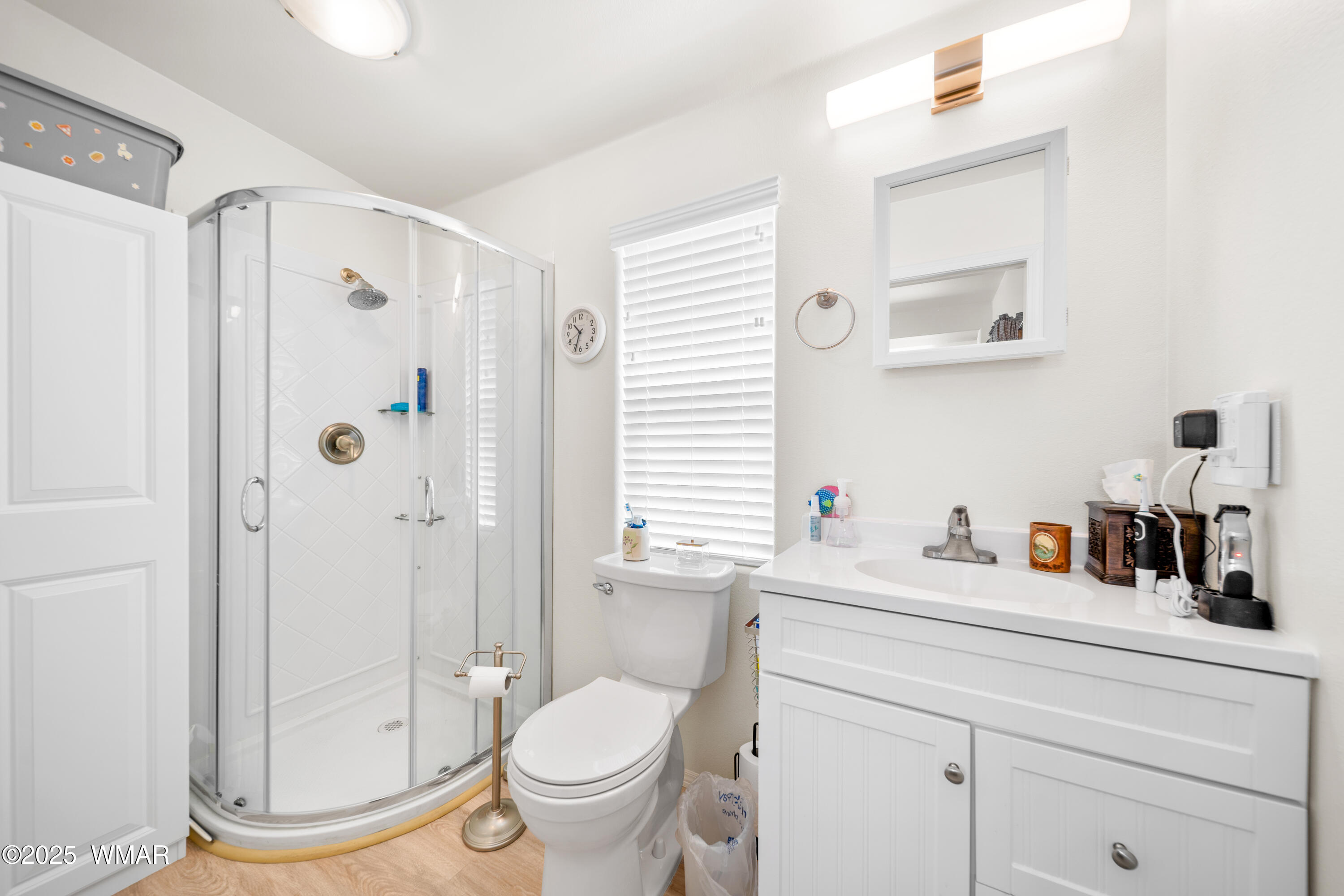 8213 Apache Way, Unit 415 Show Low, AZ 85901 - Photo 14 of 16 a bathroom with a sink toilet and shower