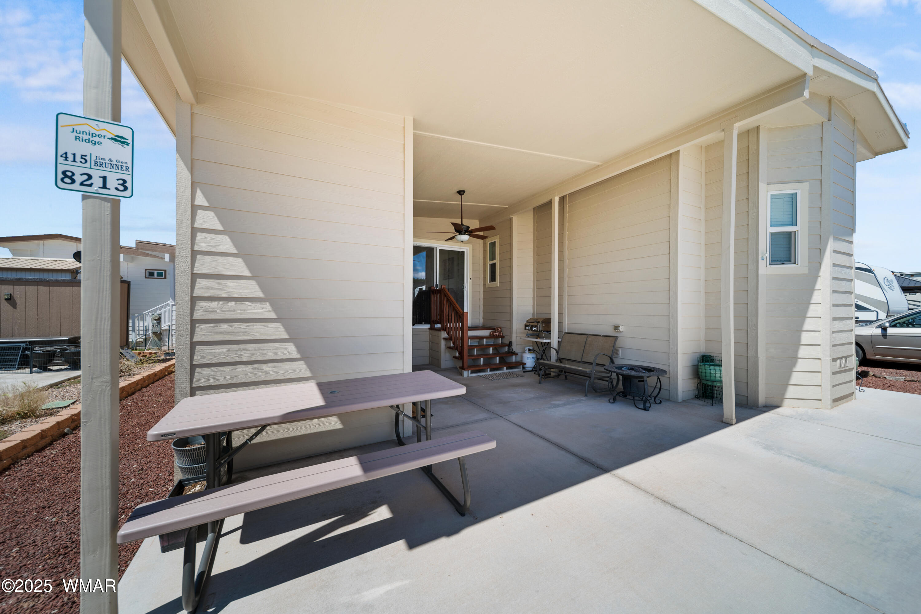 8213 Apache Way, Unit 415 Show Low, AZ 85901 - Photo 2 of 16 a bedroom with furniture and a wooden floor