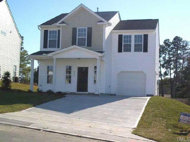 6811 Spanglers Spring Way Raleigh, NC 27610 - Photo 1 of 7 a front view of a house with a yard