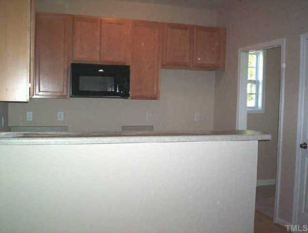 6811 Spanglers Spring Way Raleigh, NC 27610 - Photo 5 of 7 a view of kitchen and window