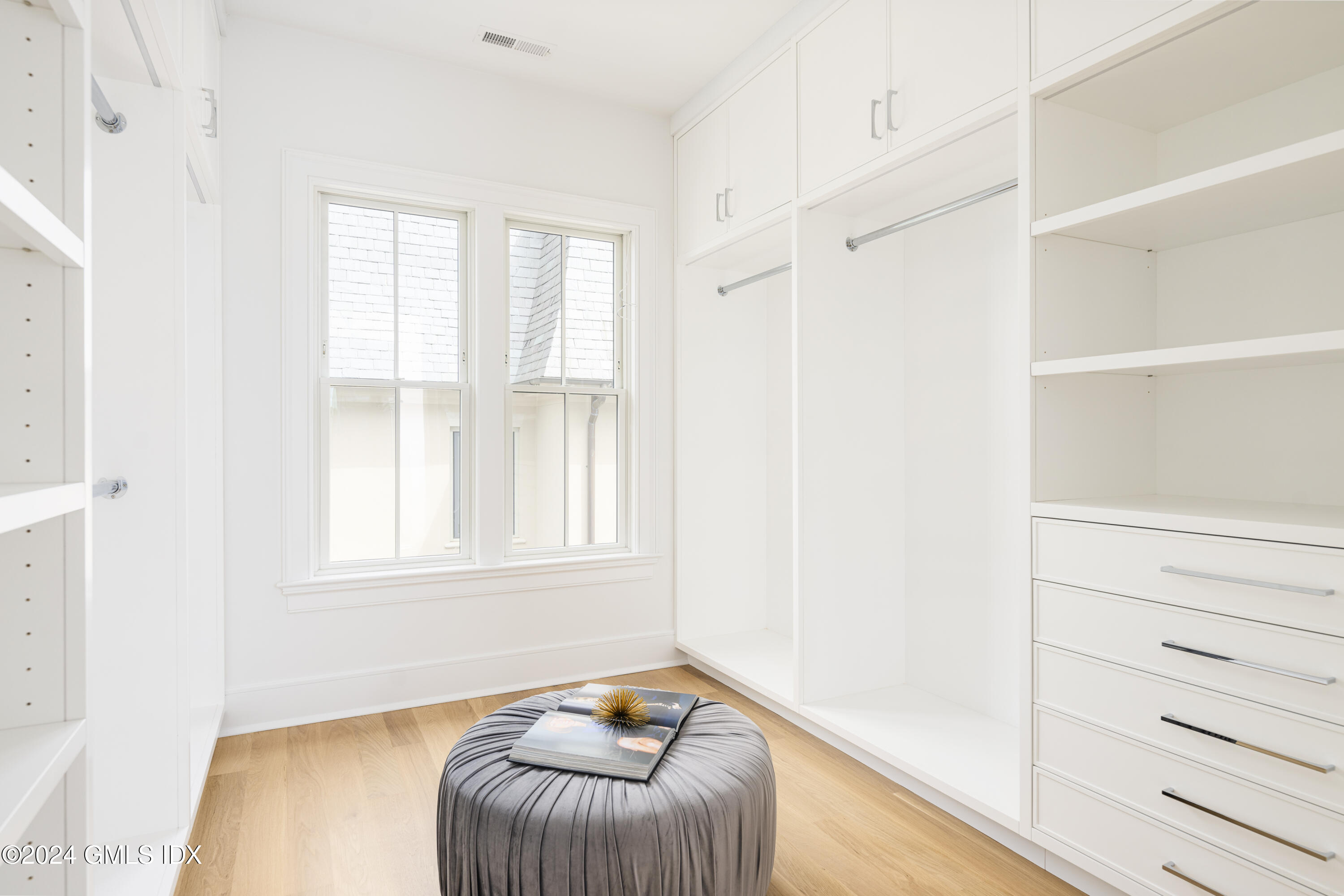 66 Ridge Street Greenwich, CT 06830 - Photo 21 of 40 a living room with furniture and a window
