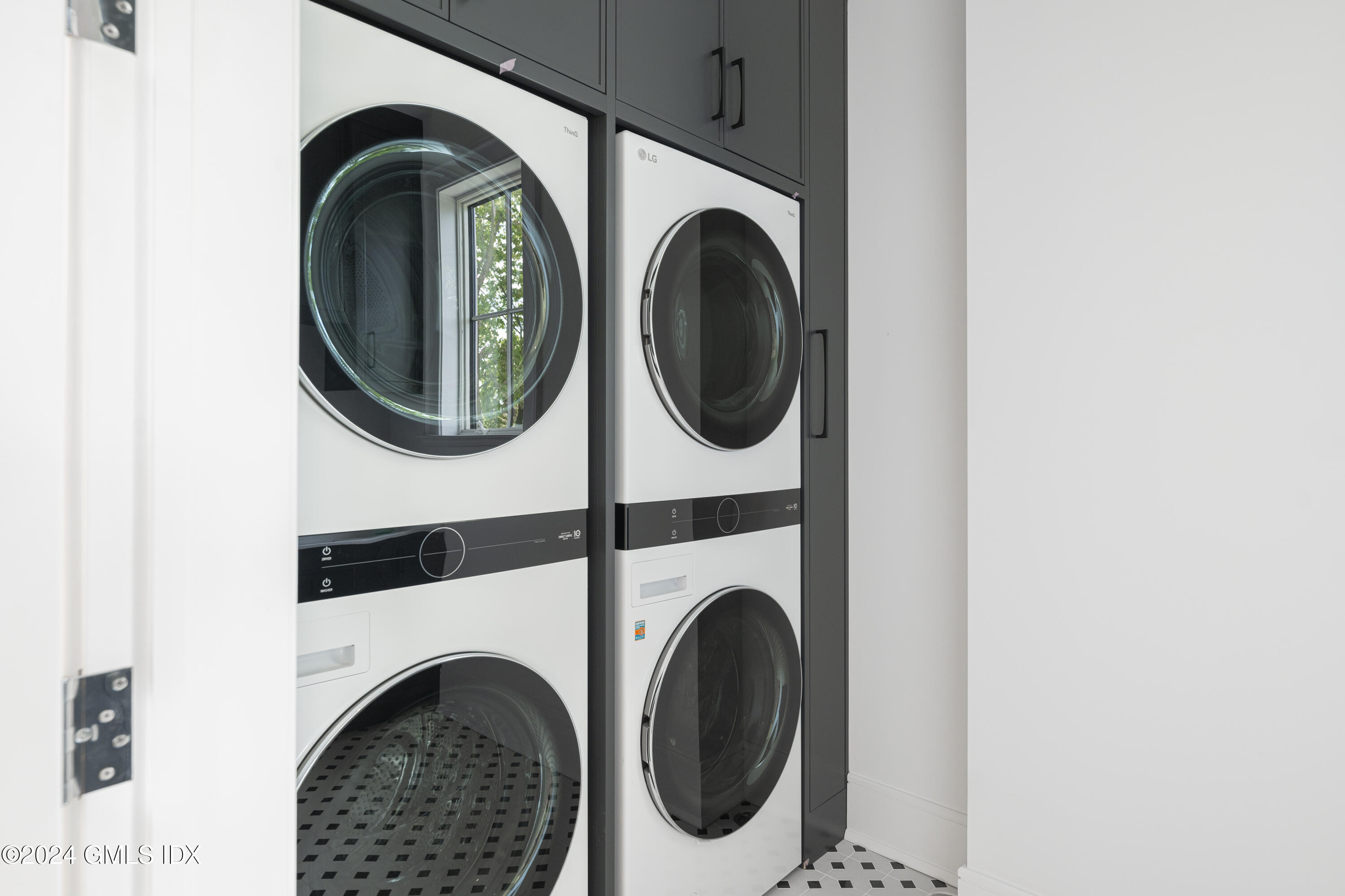 66 Ridge Street Greenwich, CT 06830 - Photo 24 of 40 a utility room with dryer and washer