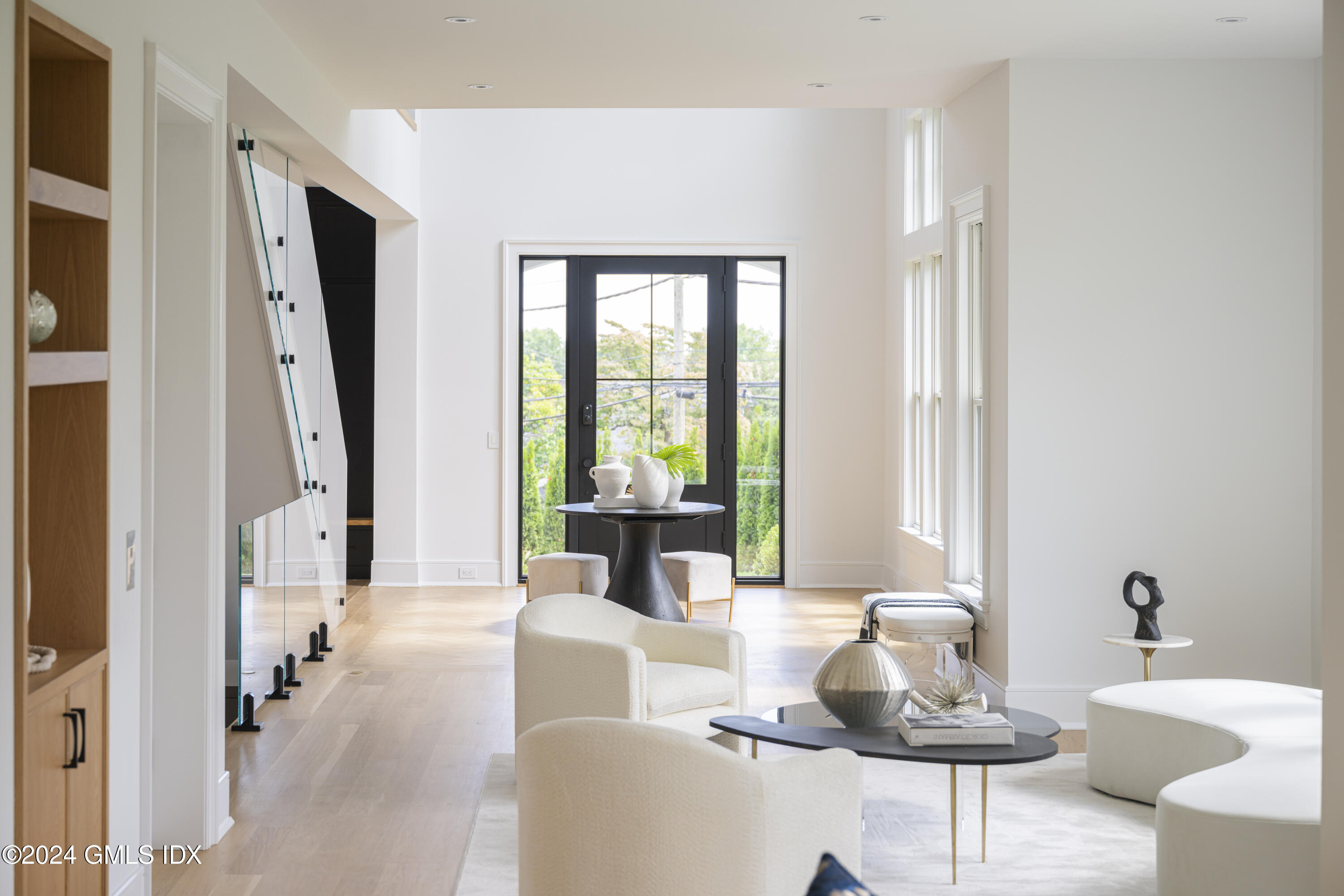 66 Ridge Street Greenwich, CT 06830 - Photo 8 of 40 a living room with furniture and a large window