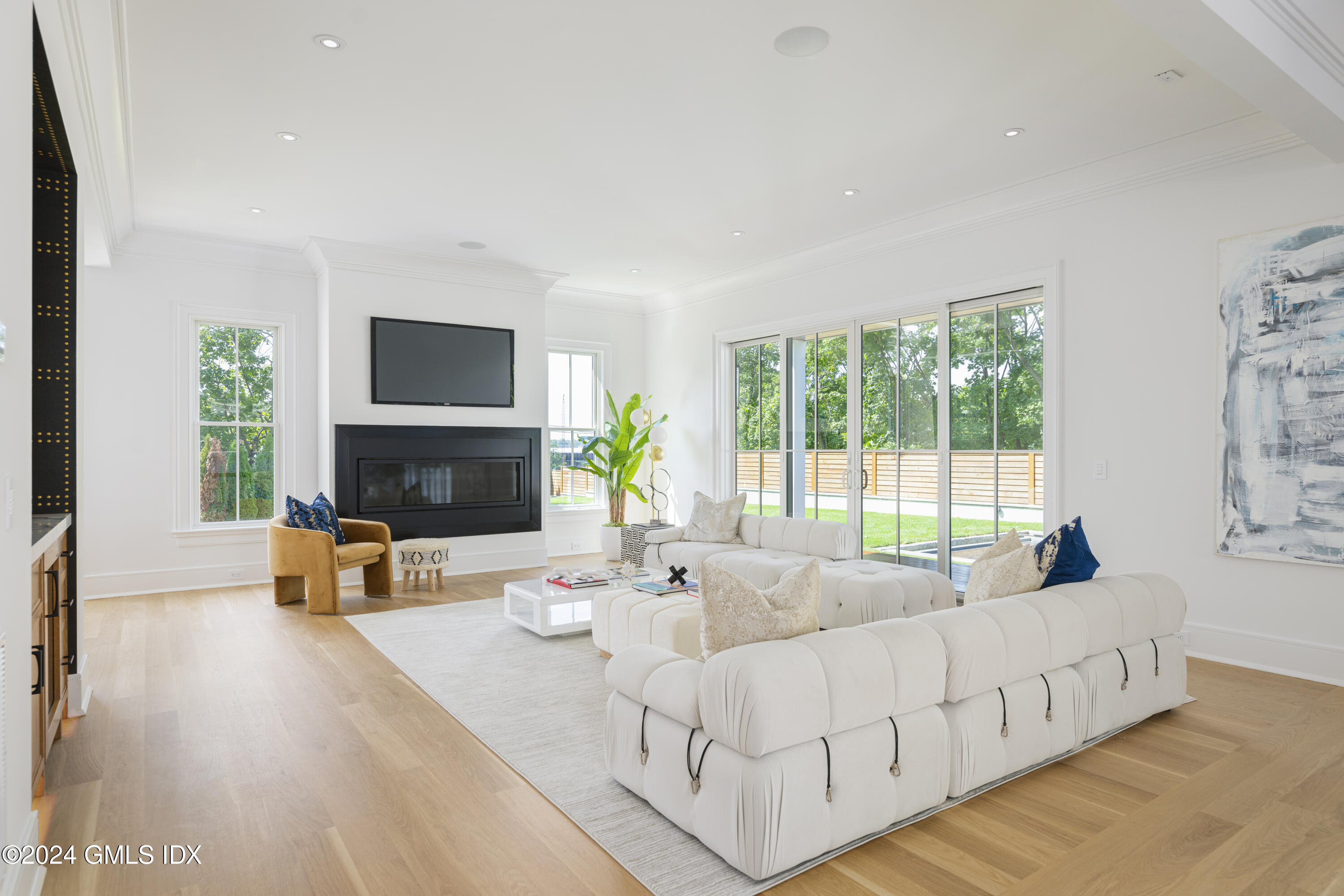 66 Ridge Street Greenwich, CT 06830 - Photo 10 of 40 a living room with furniture and a flat screen tv