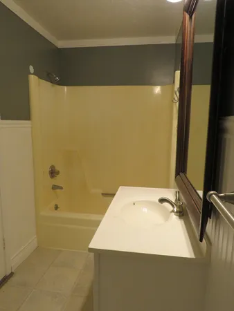 a bathroom with a sink and a shower
