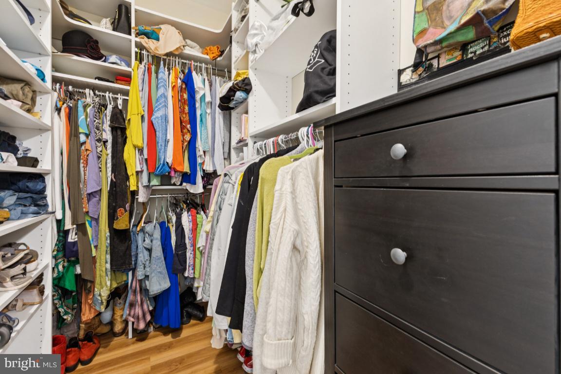 12000 Market Street, Unit 151 Reston, VA 20190 - Photo 20 of 58 Custom walk-in closet in primary suite