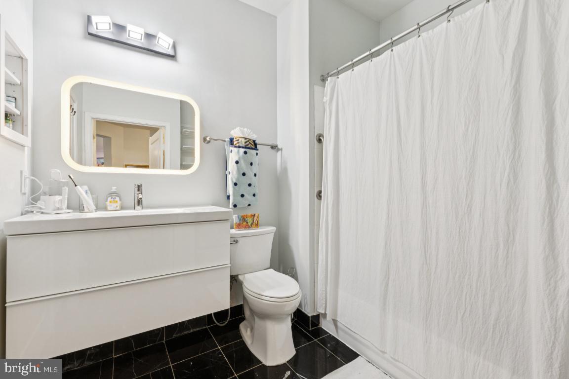 12000 Market Street, Unit 151 Reston, VA 20190 - Photo 22 of 58 2nd Full bath accessible from hallway & bedroom