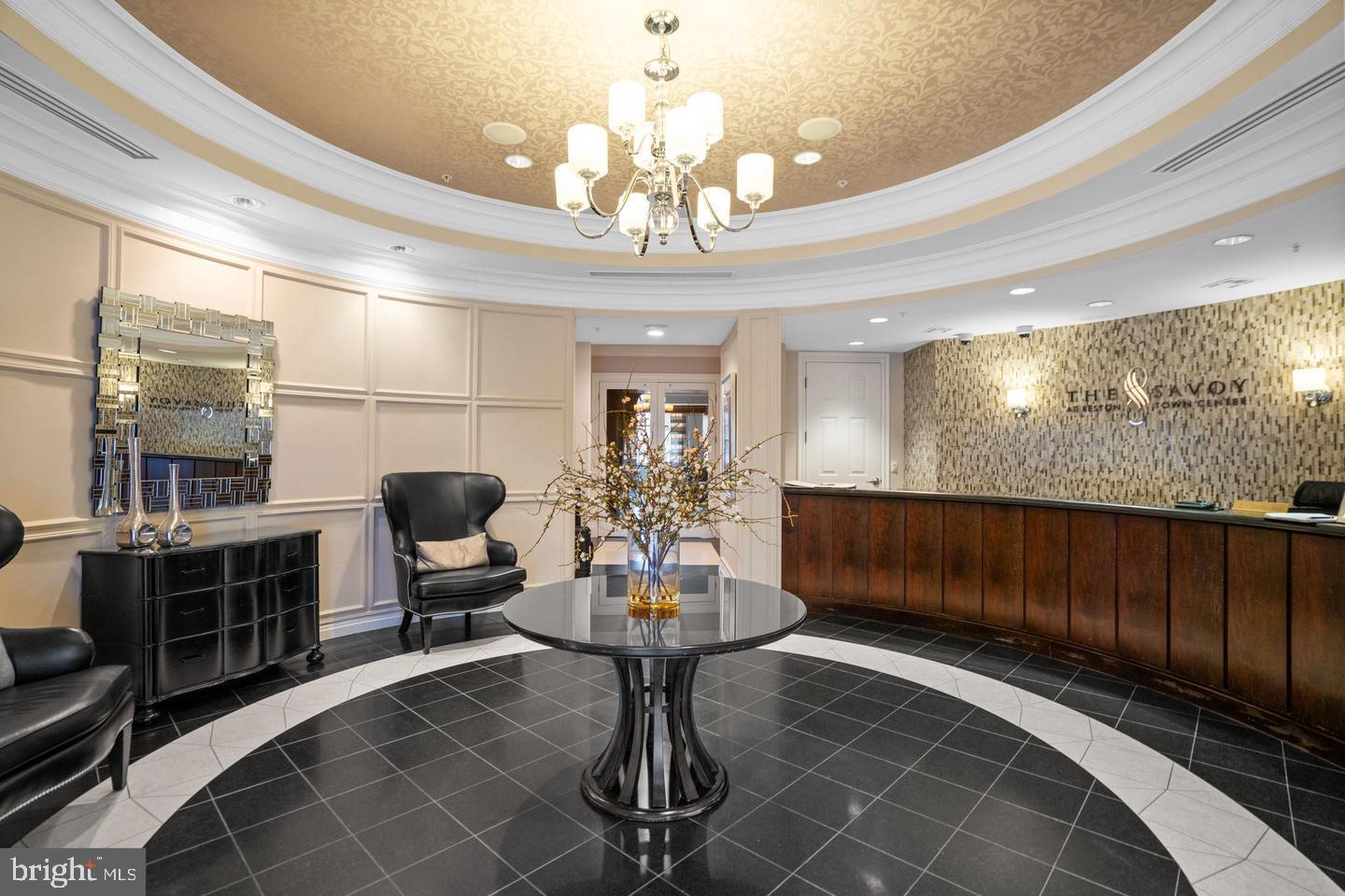 12000 Market Street, Unit 151 Reston, VA 20190 - Photo 3 of 58 Welcome to The Savoy! Lobby with a concierge.