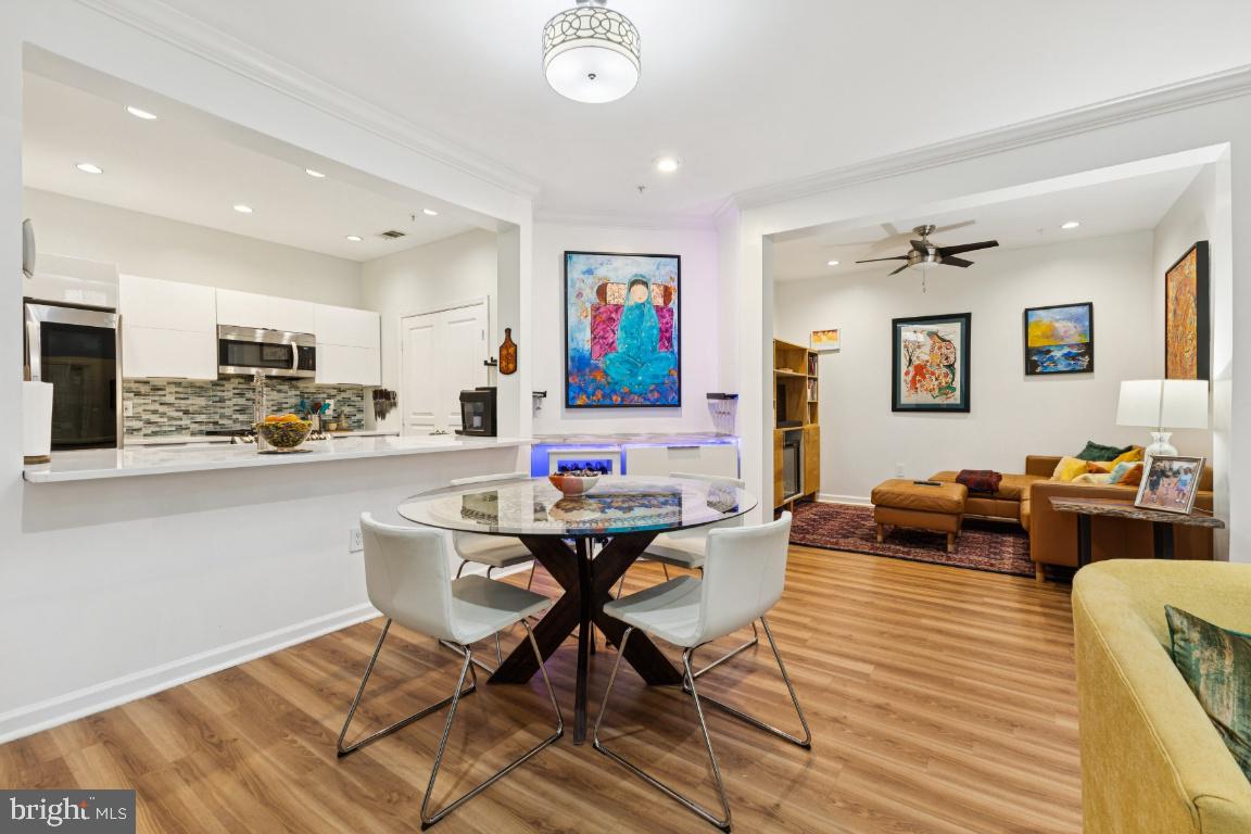 12000 Market Street, Unit 151 Reston, VA 20190 - Photo 9 of 58 Kitchen island with room to sit at least 3 people