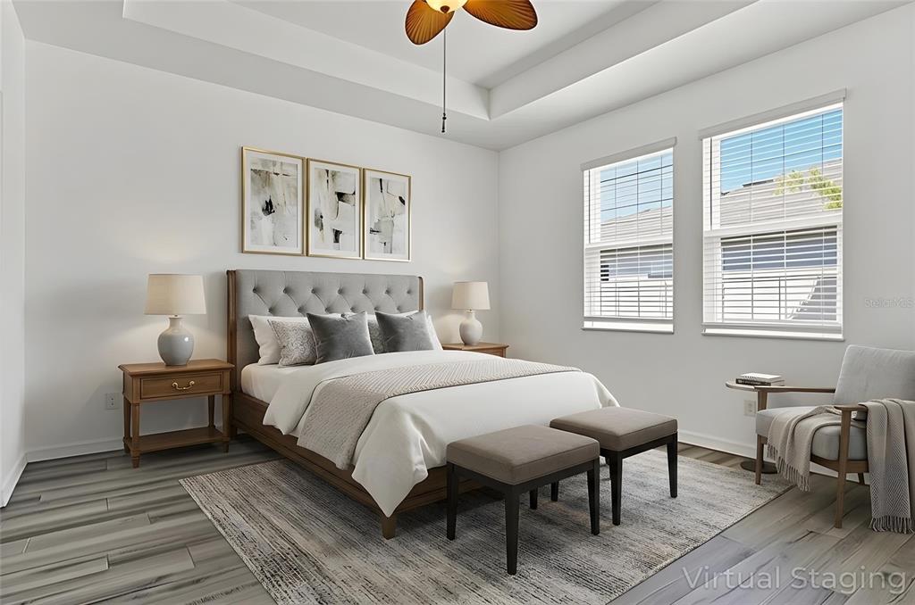 8544 Cache Drive Sarasota, FL 34240 - Photo 16 of 46 a bedroom with a bed a table and chair