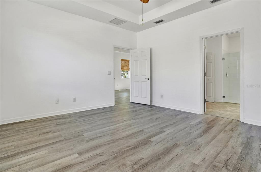 8544 Cache Drive Sarasota, FL 34240 - Photo 20 of 46 a view of an empty room and wooden floor