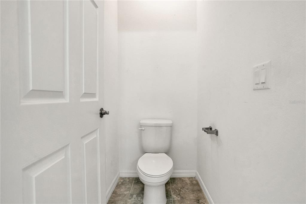 8544 Cache Drive Sarasota, FL 34240 - Photo 22 of 46 a bathroom with a toilet and a sink