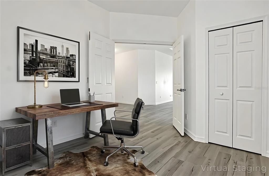 8544 Cache Drive Sarasota, FL 34240 - Photo 29 of 46 a view of a workspace with furniture and wooden floor